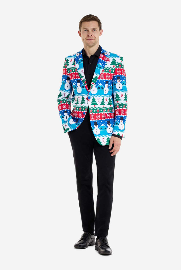 Man wearing Christmas blazer for men with Christmas winter figures. Man also wearing a black pants and black men's shirt. Full body image.