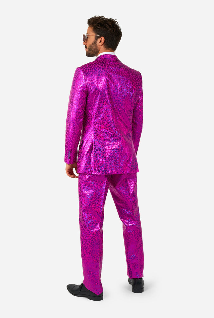 Man wearing shiny pink lizard skin men's suit, view from the back